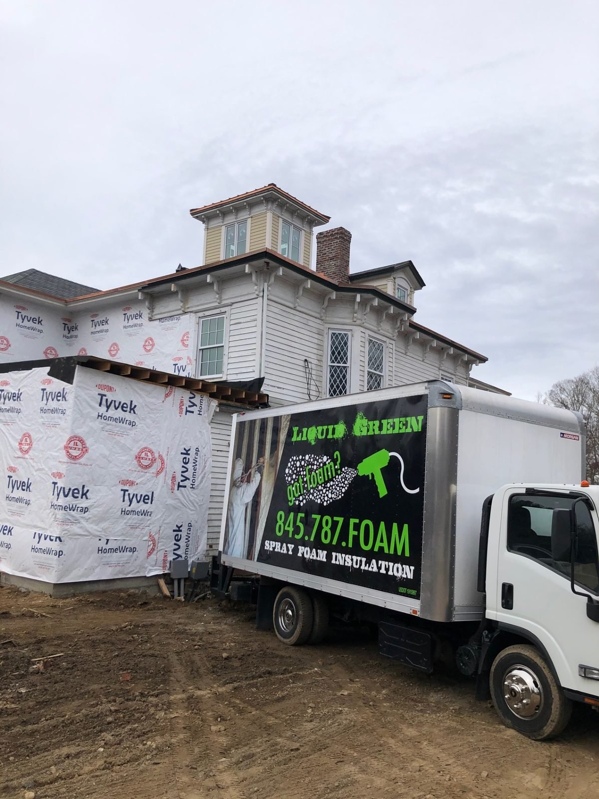 Liquid Green truck at a new-construction job site
